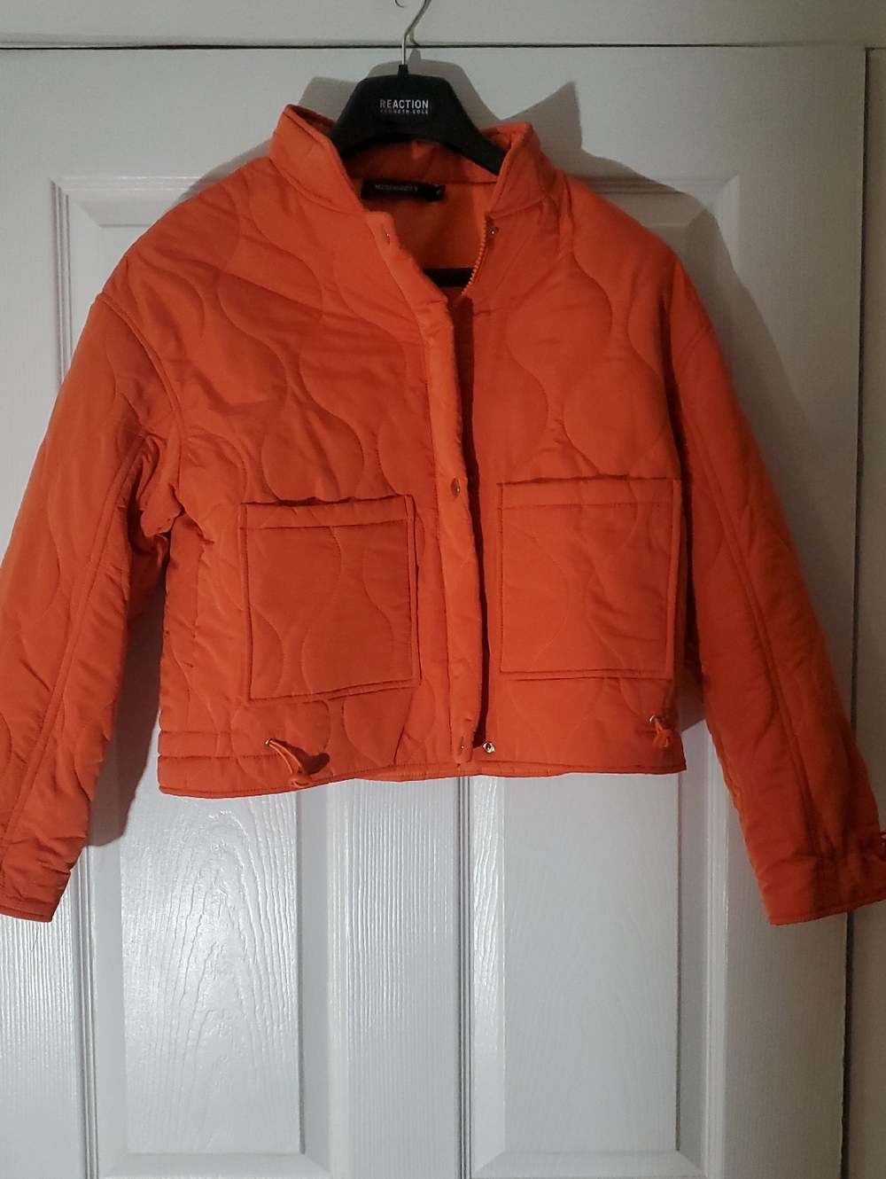 Bright orange cropped quilted puffer jacket